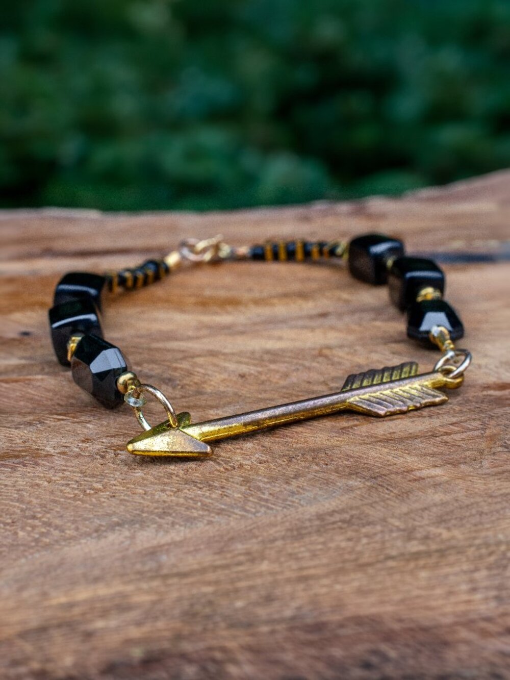 Golden Hematite, Antiqued Gold, and Black Bead Bracelet with Arrow